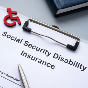 Disability claim form with pen—social media posts may impact approval in Florida cases.
