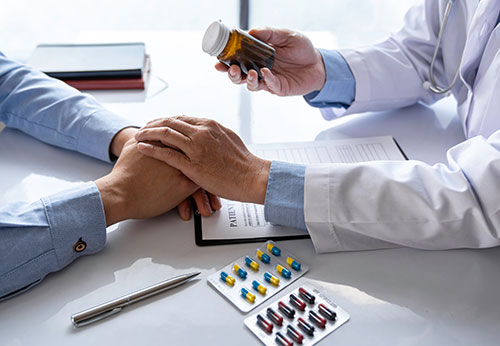 Doctor discussing medication with patient.